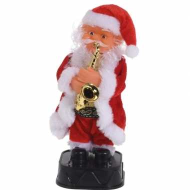 Bewegende kerstfiguren dansende kerstman met saxofoon 20 cm
