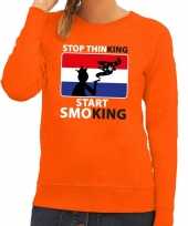 Feest oranje stop thinking start smoking sweater dames